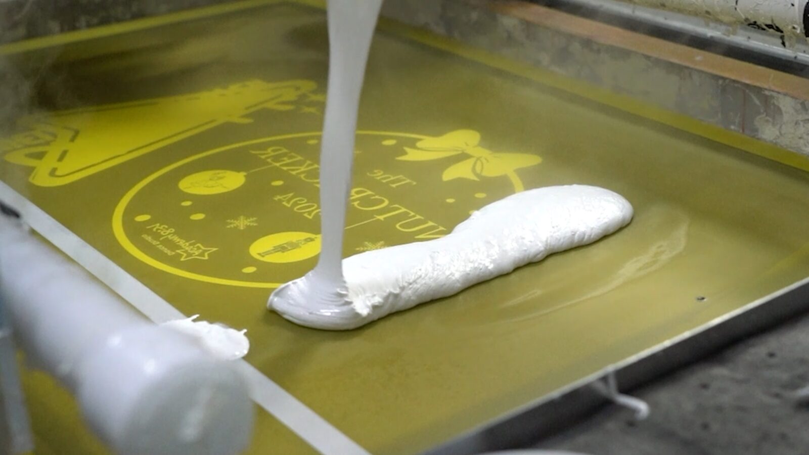 White screen-printing ink laid over a digitally printed Supacolour transfer sheet