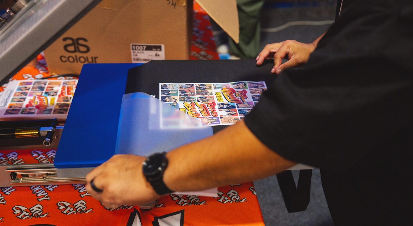 Pressing a Supacolour transfer onto an AS Colour tee at the Real Groovy event